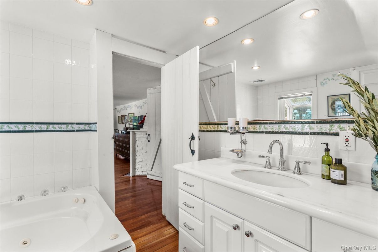 Bathroom, Dual Sink Vanities, Interior, Recessed Lighting, Wood Texture Flooring
