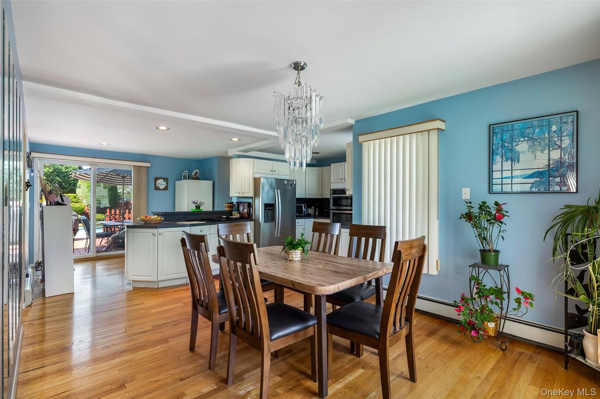 Chandelier, Dining room, Interior, Kitchen, Recessed Lighting, Stainless Steel Appliances, Wood Texture Flooring