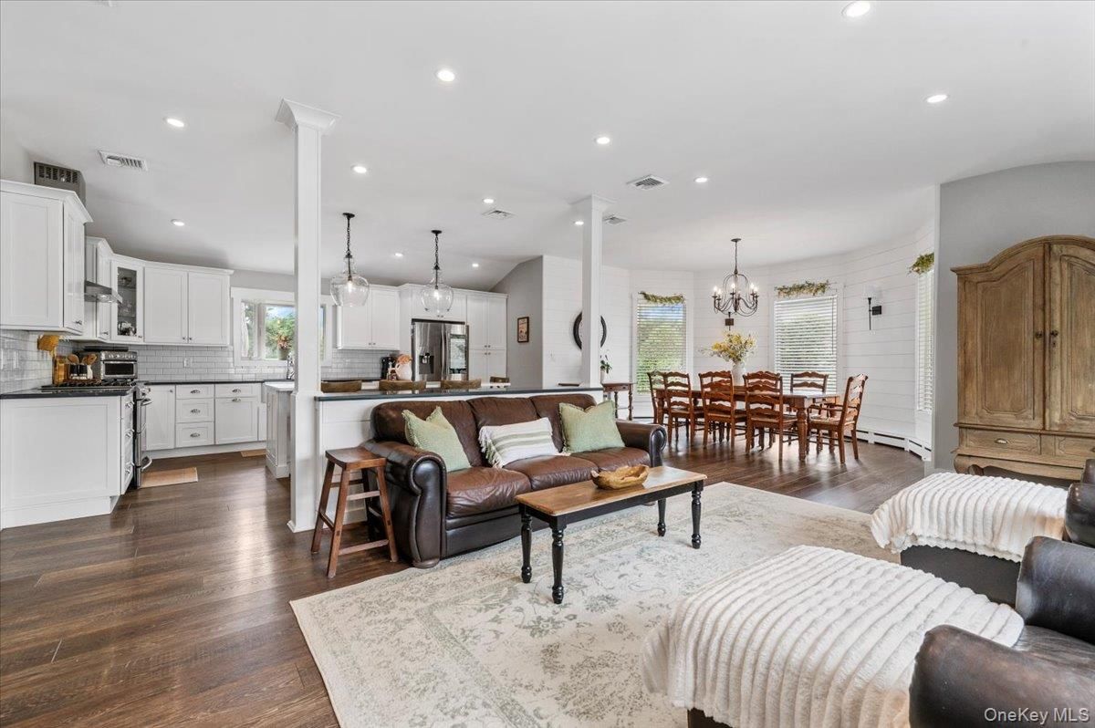 Chandelier, Dining room, Interior, Kitchen, Living room, Pendant Lights, Recessed Lighting, Stainless Steel Appliances, Wood Texture Flooring