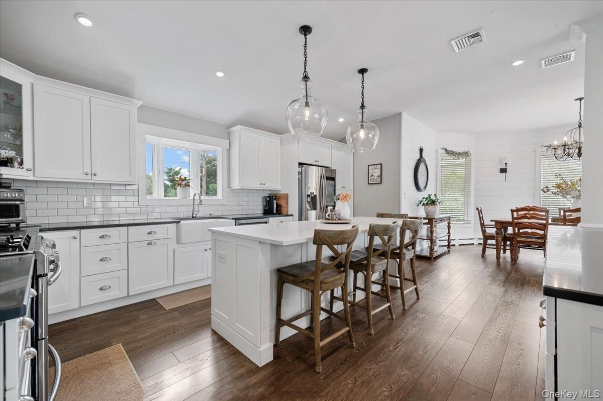 Chandelier, Dining room, Interior, Kitchen, Pendant Lights, Recessed Lighting, Stainless Steel Appliances, Wood Texture Flooring