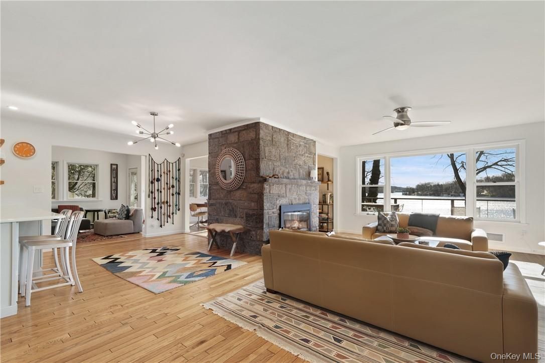 Fireplace, Interior, Living room, Pendant Lights, Recessed Lighting, Stone Walls, Wood Texture Flooring