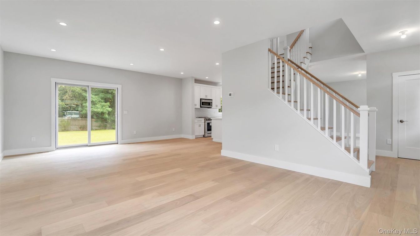 Empty room, Interior, Kitchen, Recessed Lighting, Stainless Steel Appliances, Wood Texture Flooring