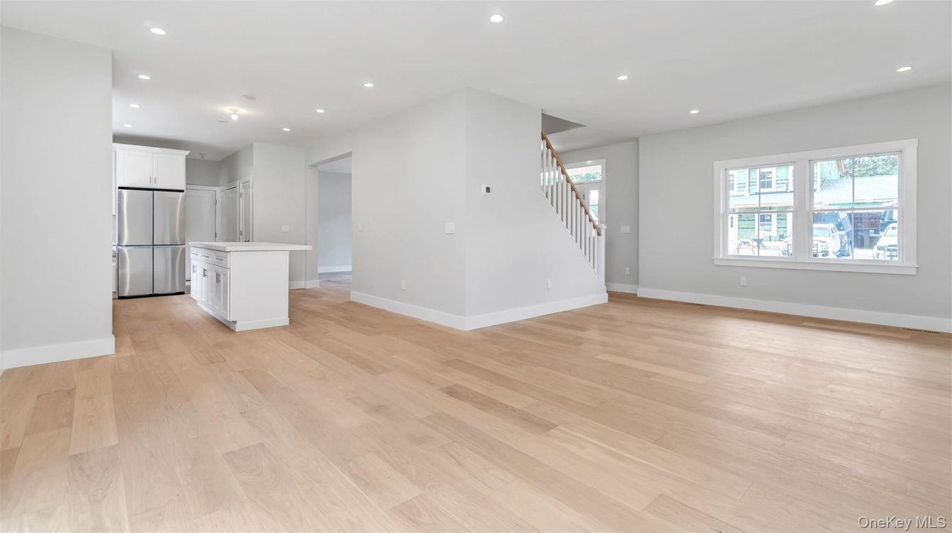 Empty room, Interior, Kitchen, Recessed Lighting, Stainless Steel Appliances, Wood Texture Flooring