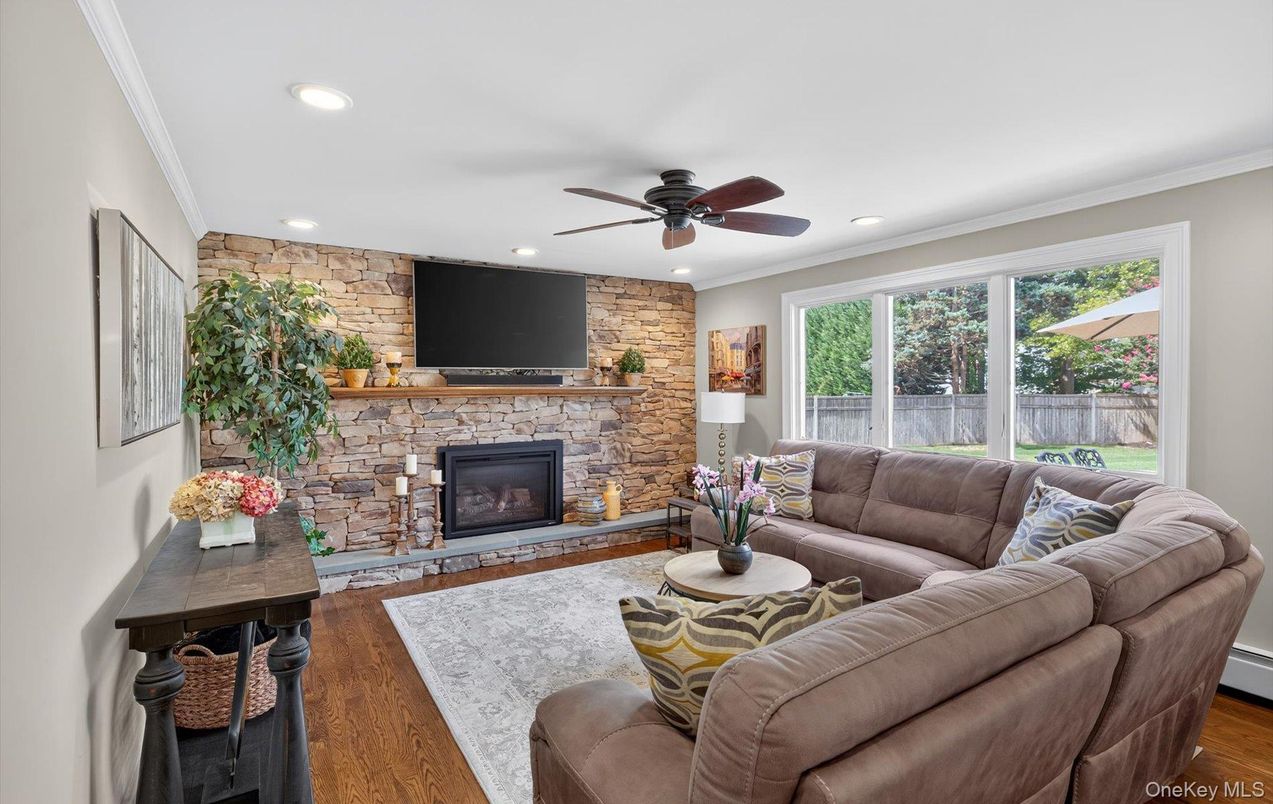 Fireplace, Interior, Living room, Recessed Lighting, Stone Walls, Wood Texture Flooring