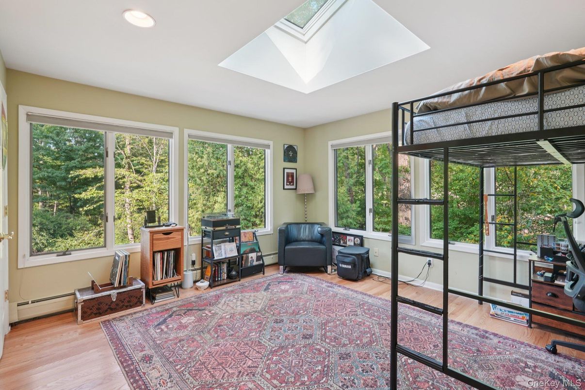 Fireplace, Interior, Recessed Lighting, Sun Room, Wood Texture Flooring