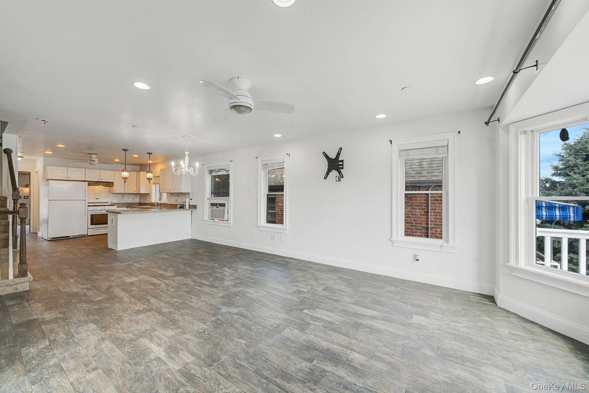 Chandelier, Empty room, Interior, Kitchen, Pendant Lights, Recessed Lighting, Stainless Steel Appliances, Wood Texture Flooring