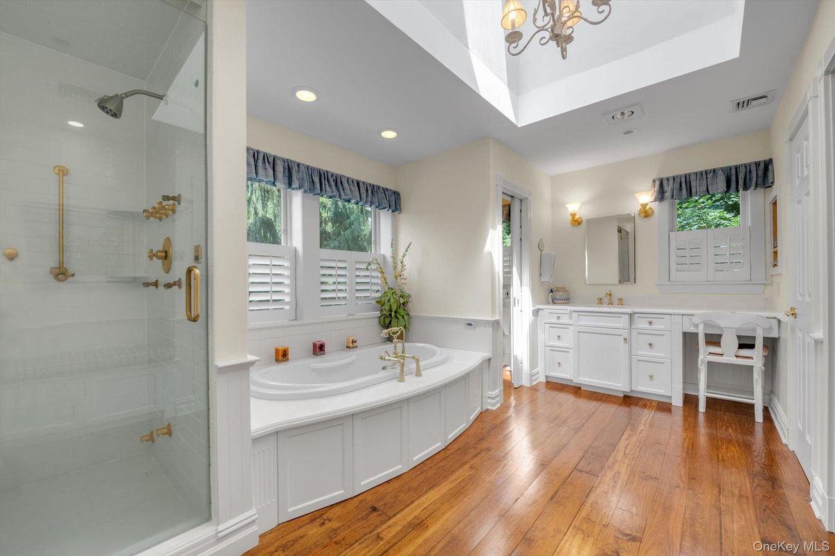 Bathroom, Dual Sink Vanities, Glass Shower, Interior, Recessed Lighting, Wood Texture Flooring