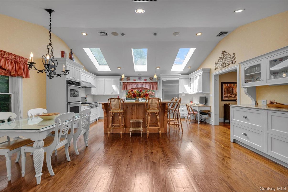 Dining room, Interior, Kitchen, Pendant Lights, Recessed Lighting, Stainless Steel Appliances, Wood Texture Flooring
