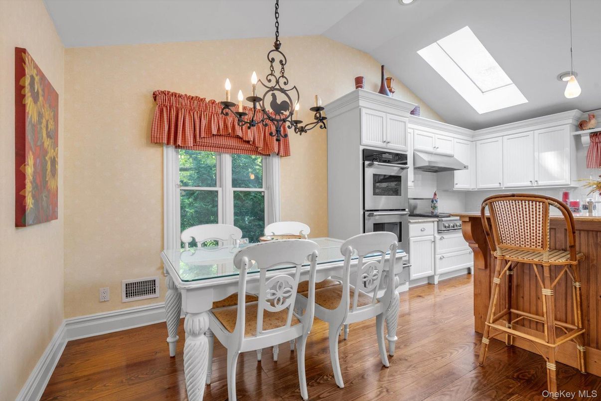 Chandelier, Dining room, Interior, Kitchen, Pendant Lights, Recessed Lighting, Stainless Steel Appliances, Wood Texture Flooring
