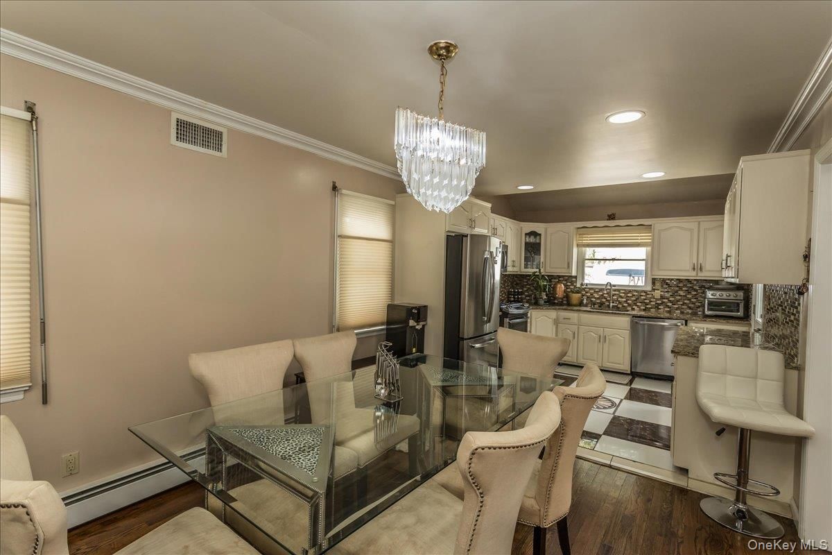 Chandelier, Dining room, Interior, Kitchen, Recessed Lighting, Stainless Steel Appliances, Wood Texture Flooring