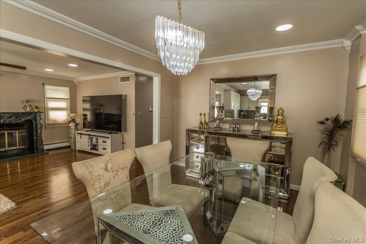 Chandelier, Dining room, Fireplace, Interior, Living room, Recessed Lighting, Wood Texture Flooring