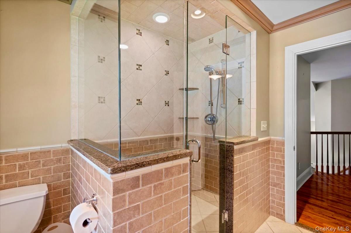 Bathroom, Glass Shower, Interior, Recessed Lighting, Stone Walls, Wood Texture Flooring