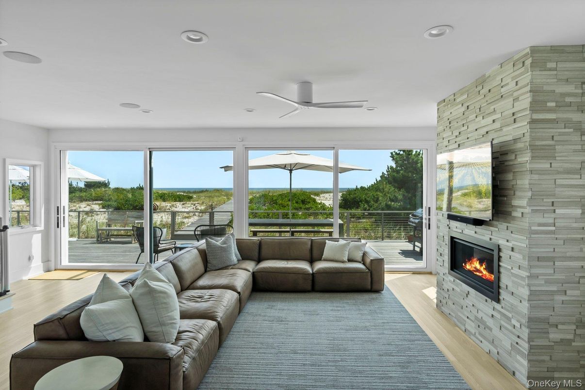 Fireplace, Interior, Living room, Recessed Lighting, Stone Walls, Wood Texture Flooring