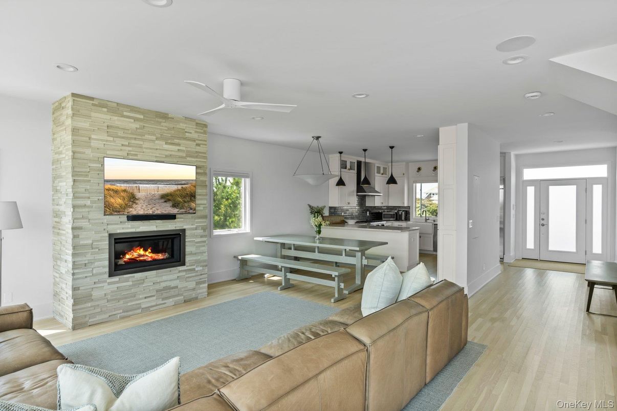 Dining room, Fireplace, Interior, Kitchen, Living room, Pendant Lights, Recessed Lighting, Stainless Steel Appliances, Stone Walls, Wood Texture Flooring