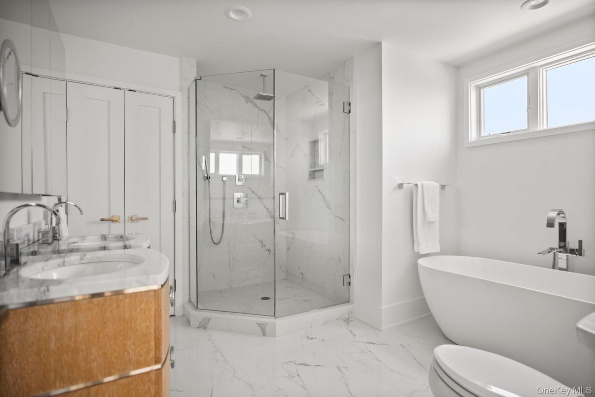 Bathroom, Free Standing Baths, Glass Shower, Interior, Marble, Marble Walls, Recessed Lighting