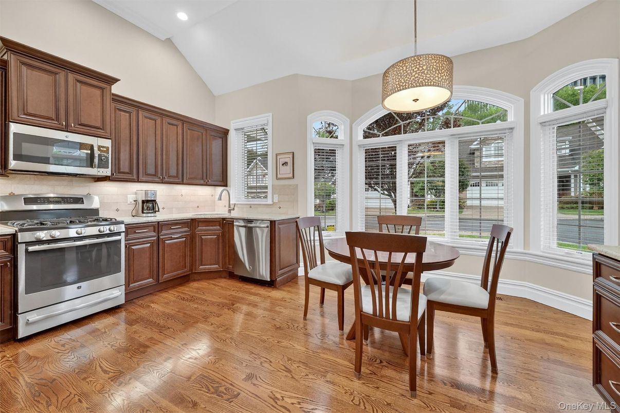 Dining room, Interior, Kitchen, Pendant Lights, Recessed Lighting, Stainless Steel Appliances, Wood Texture Flooring