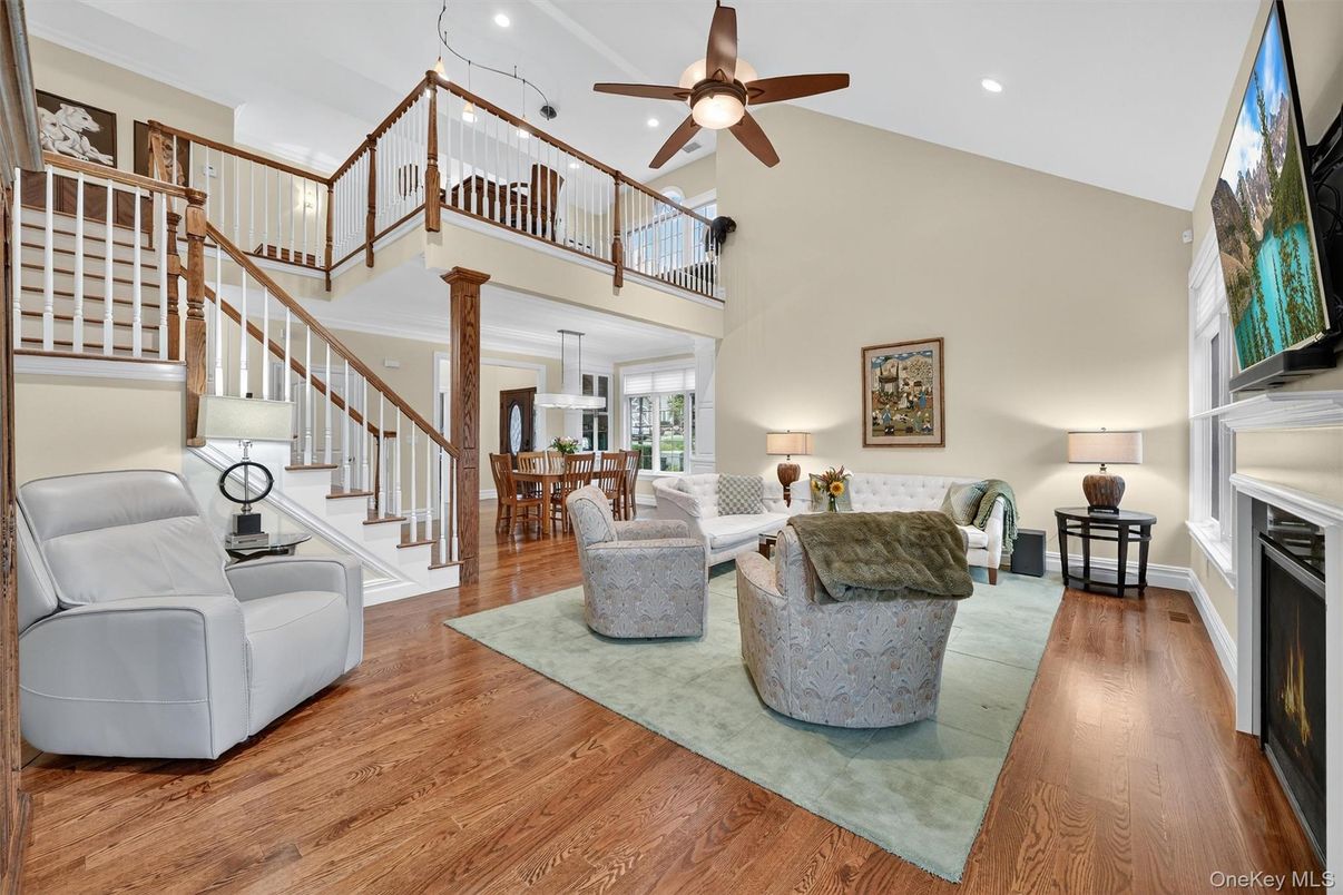 Dining room, Fireplace, Interior, Living room, Recessed Lighting, Wood Texture Flooring
