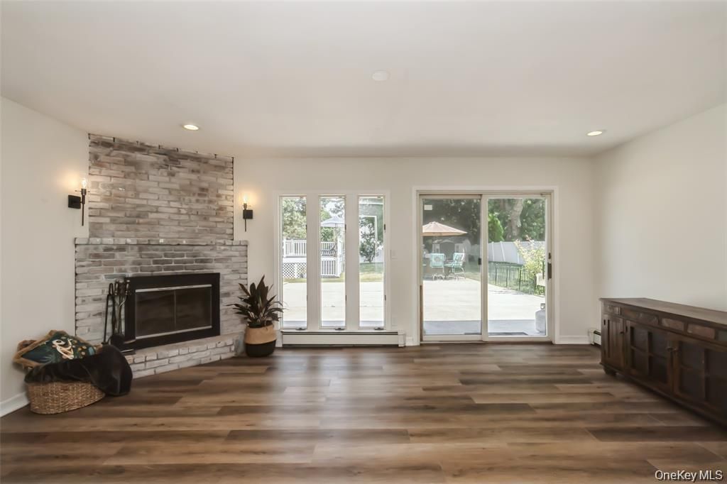 Empty room, Fireplace, Interior, Recessed Lighting, Stone Walls, Wood Texture Flooring