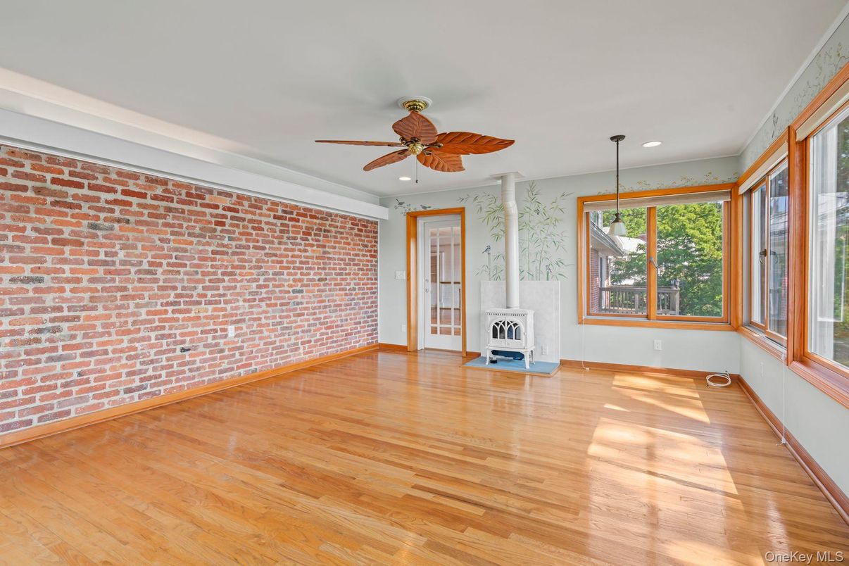 Empty room, Fireplace, Interior, Recessed Lighting, Stone Walls, Wood Texture Flooring