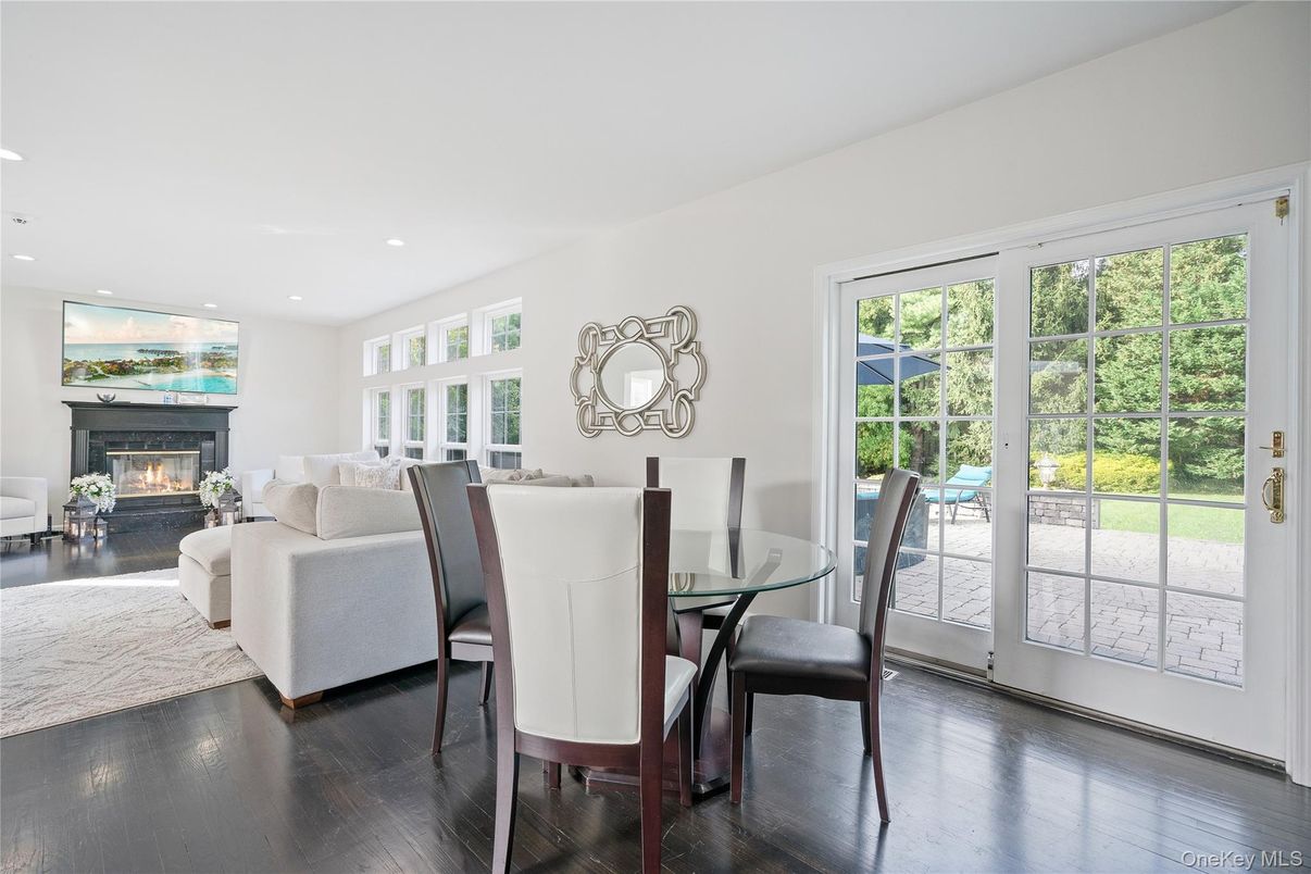 Dining room, Fireplace, Interior, Living room, Recessed Lighting, Wood Texture Flooring