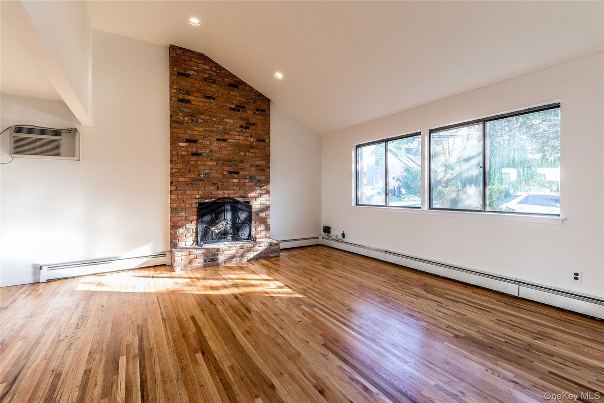 Empty room, Fireplace, Interior, Recessed Lighting, Stone Walls, Wood Texture Flooring