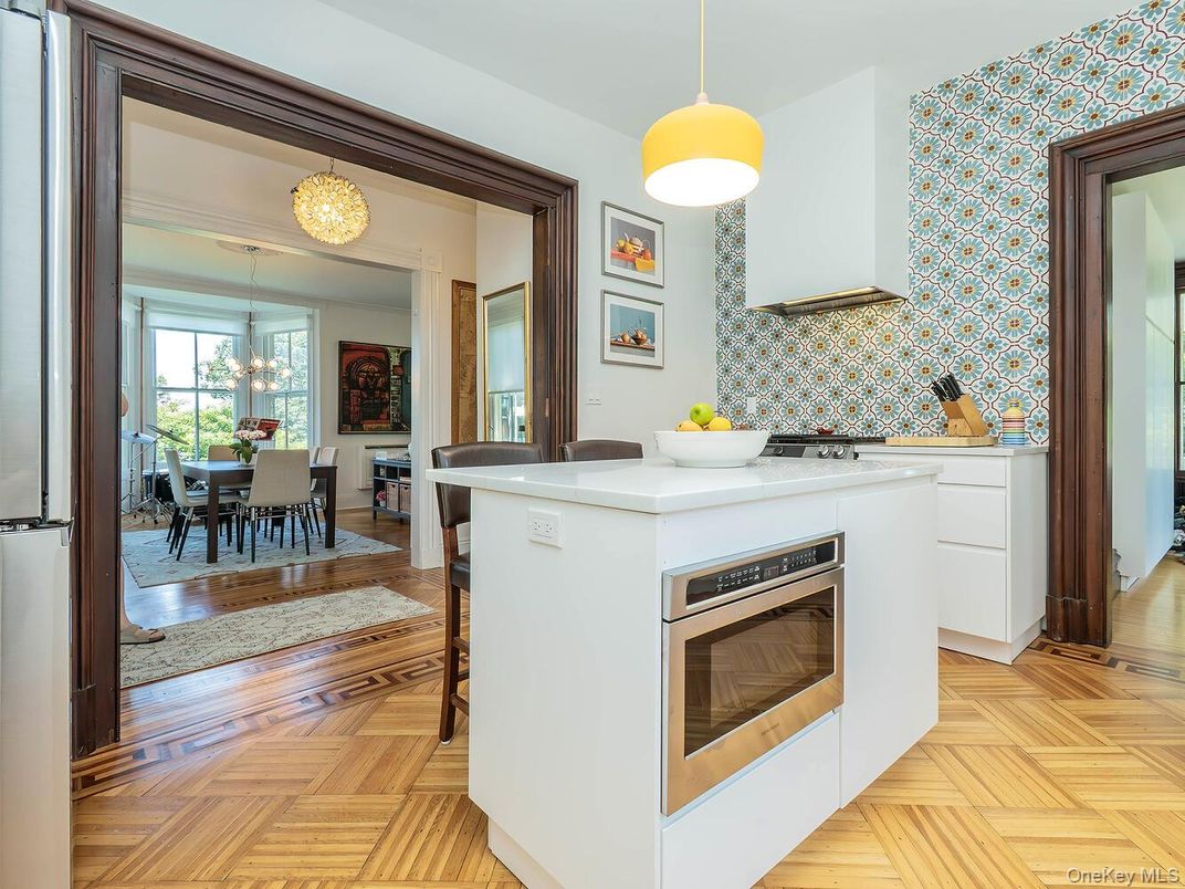 Chandelier, Dining room, Interior, Kitchen, Pendant Lights, Stainless Steel Appliances, Wood Texture Flooring
