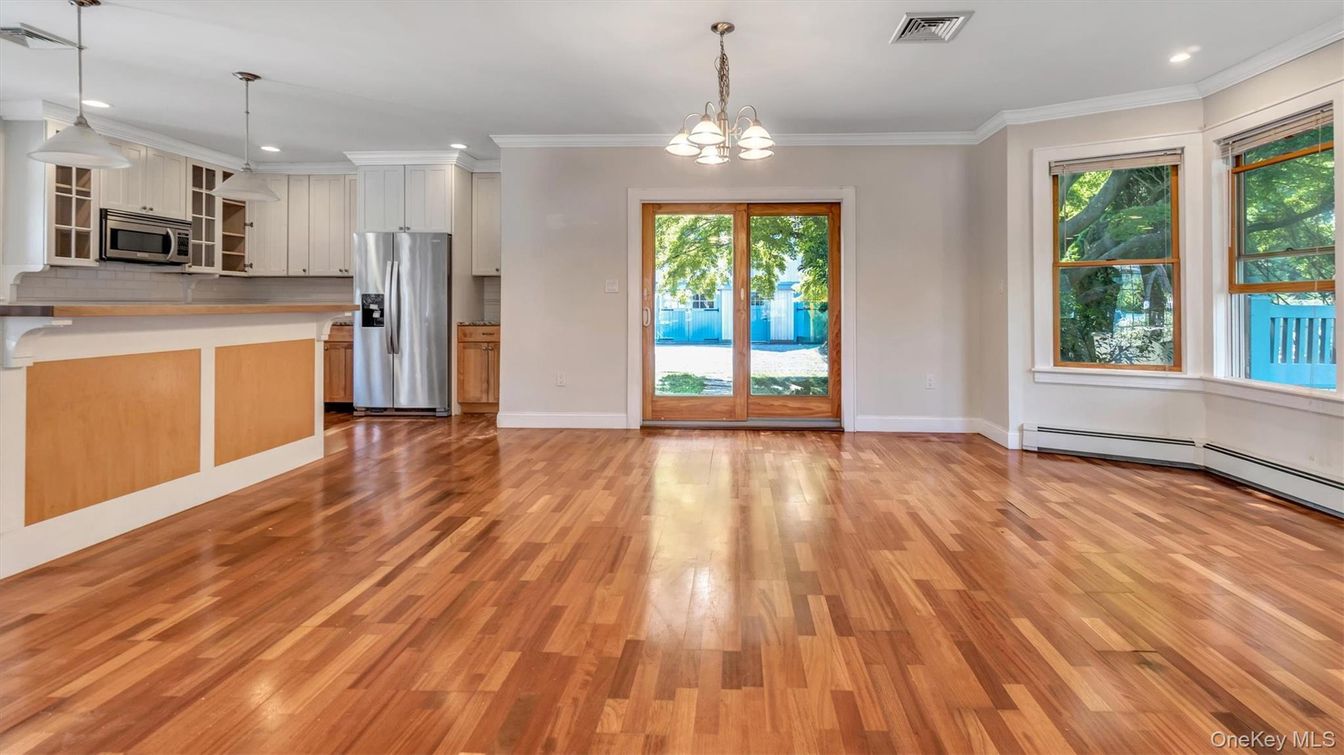 Empty room, Interior, Kitchen, Pendant Lights, Recessed Lighting, Stainless Steel Appliances, Wood Texture Flooring