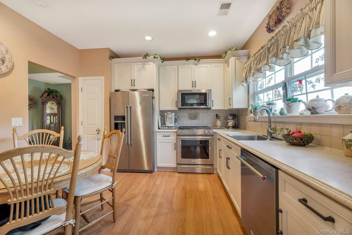 Dining room, Interior, Kitchen, Recessed Lighting, Stainless Steel Appliances, Wood Texture Flooring