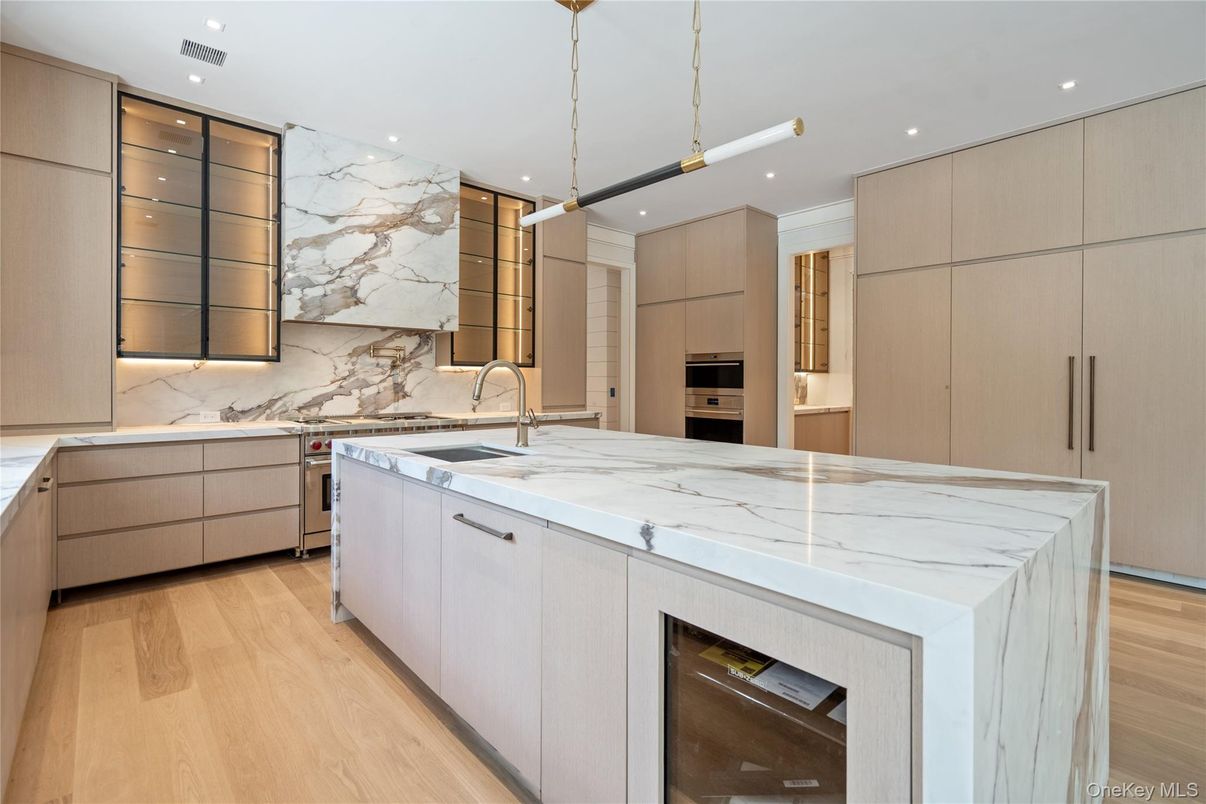 Interior, Kitchen, Marble Walls, Pendant Lights, Recessed Lighting, Stainless Steel Appliances, Wood Texture Flooring