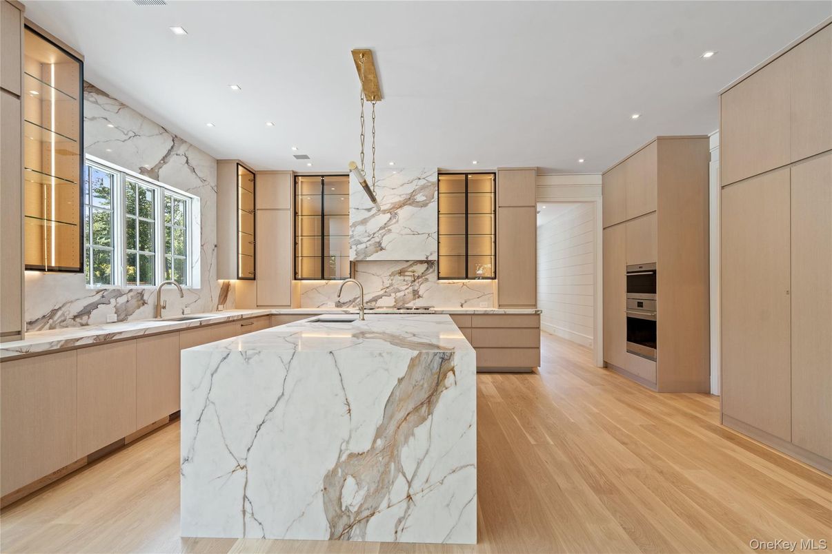 Interior, Kitchen, Marble Walls, Recessed Lighting, Stainless Steel Appliances, Wood Texture Flooring