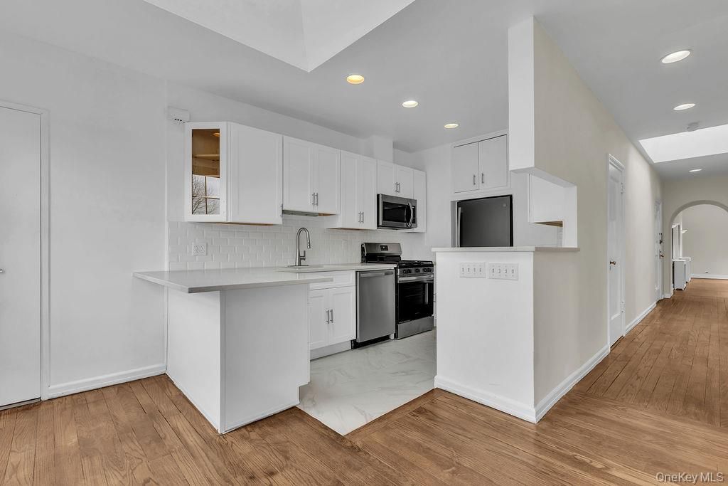 Interior, Kitchen, Marble, Recessed Lighting, Stainless Steel Appliances, Wood Texture Flooring