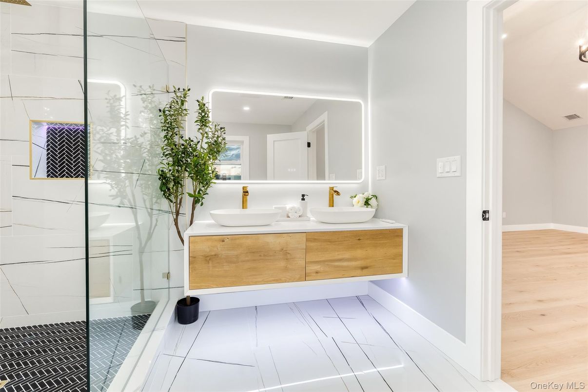 Bathroom, Dual Sink Vanities, Glass Shower, Interior, Recessed Lighting, Tile Countertops, Wood Texture Flooring