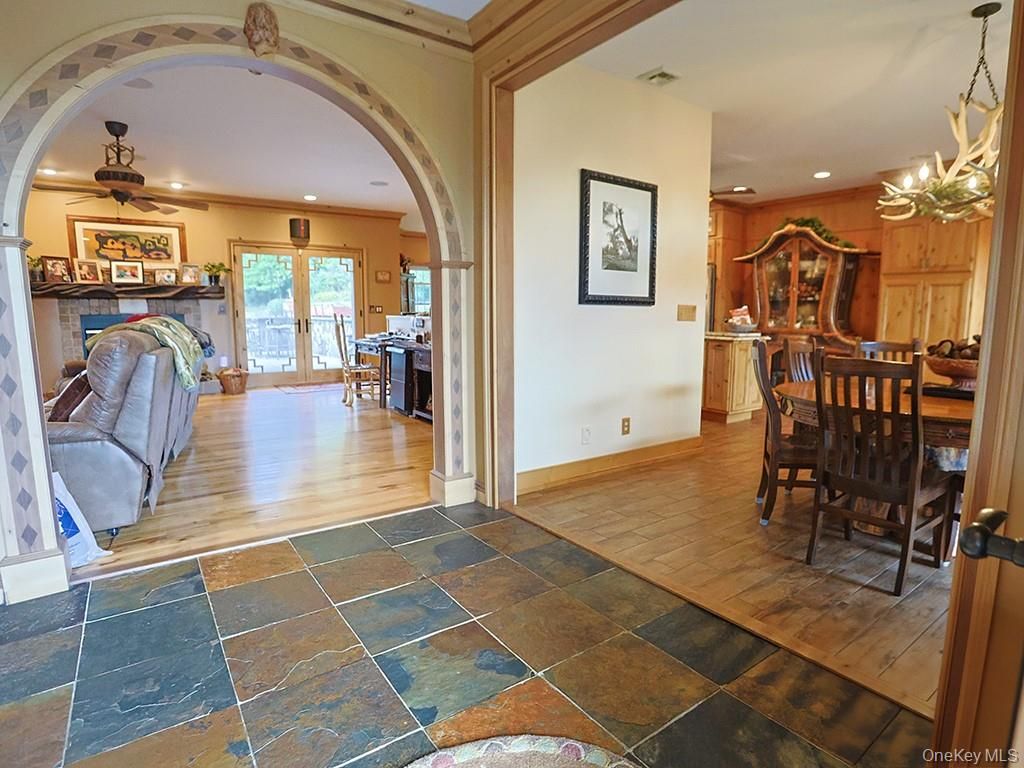 Chandelier, Dining room, Fireplace, Interior, Recessed Lighting, Wood Texture Flooring
