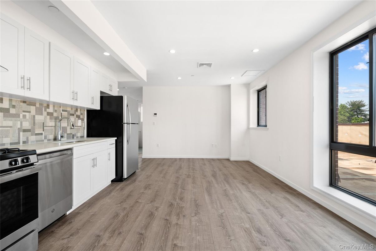 Interior, Kitchen, Recessed Lighting, Stainless Steel Appliances, Wood Texture Flooring
