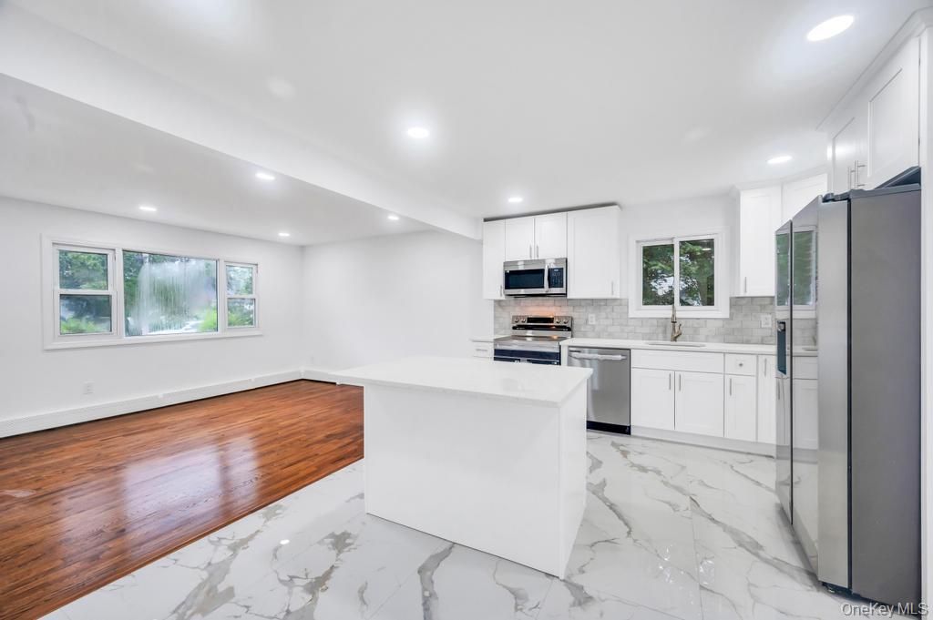 Interior, Kitchen, Marble, Recessed Lighting, Stainless Steel Appliances, Wood Texture Flooring