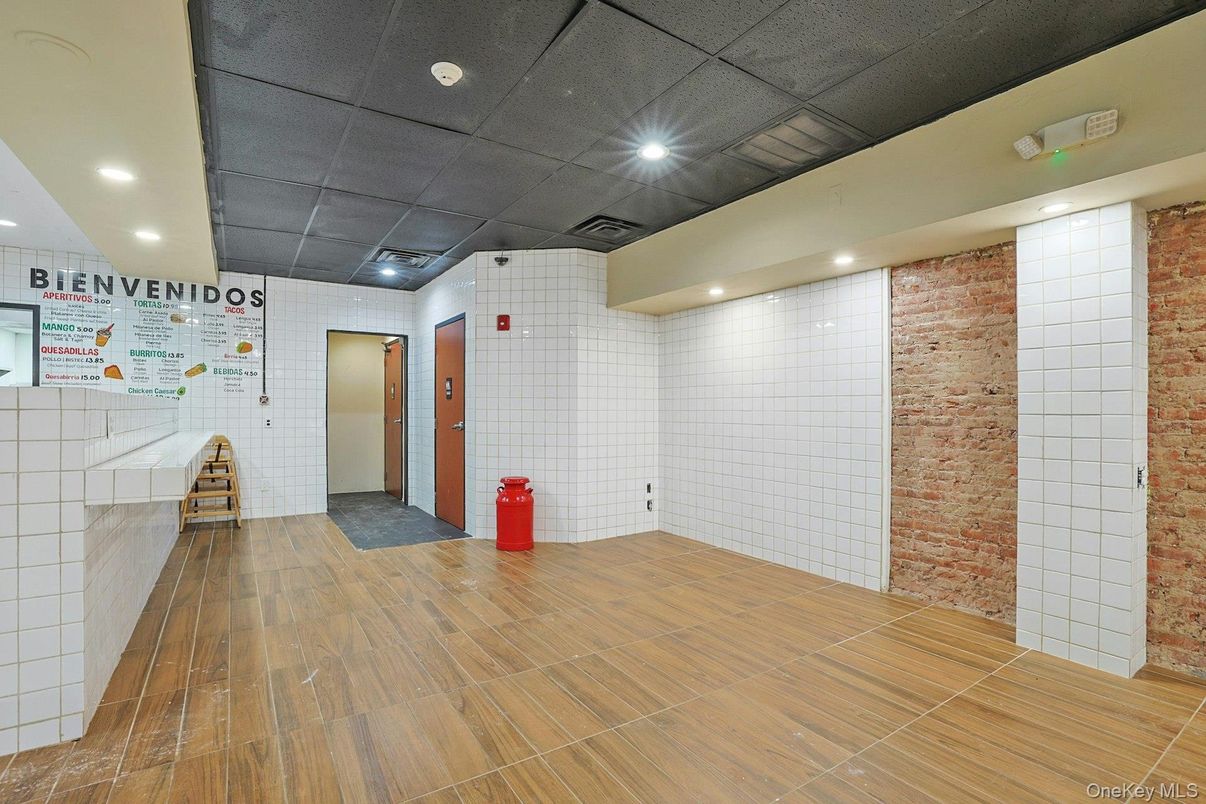 Elevator, Interior, Recessed Lighting, Stone Walls, Wood Texture Flooring