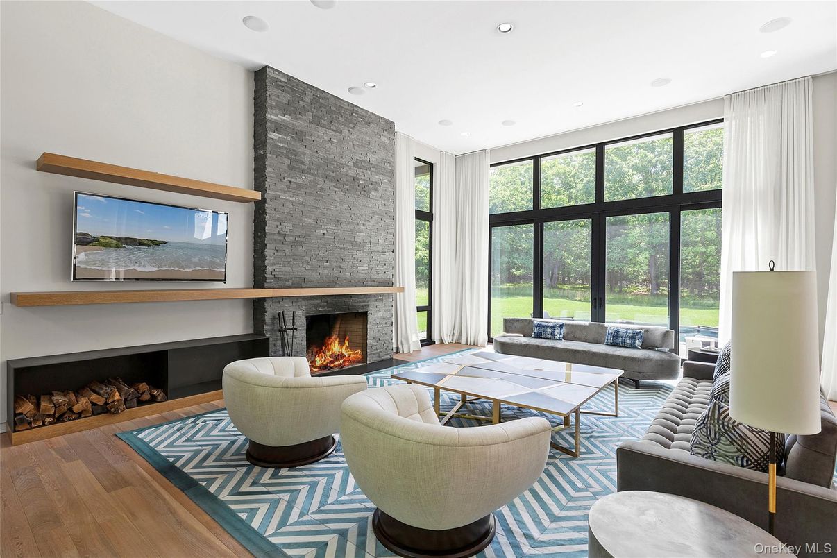 Fireplace, Interior, Living room, Recessed Lighting, Stone Walls, Wood Texture Flooring