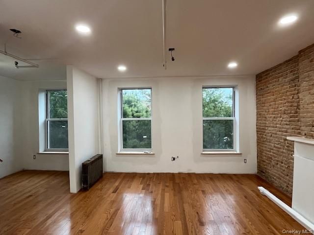 Empty room, Interior, Recessed Lighting, Stone Walls, Wood Texture Flooring