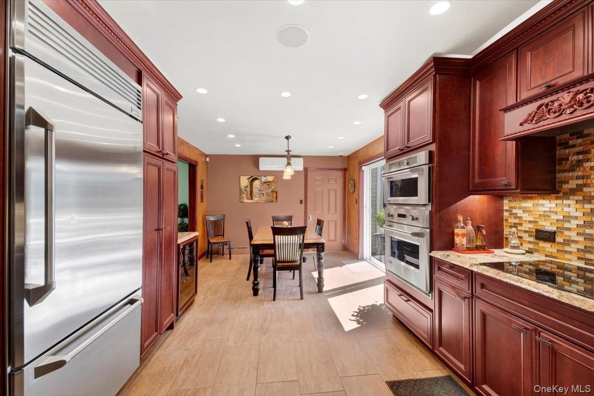 Dining room, Interior, Kitchen, Recessed Lighting, Stainless Steel Appliances, Wood Texture Flooring