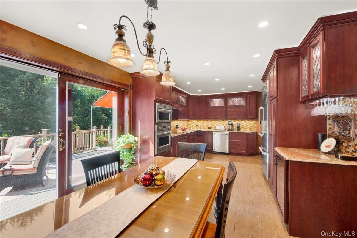 Dining room, Interior, Kitchen, Recessed Lighting, Stainless Steel Appliances, Wood Texture Flooring