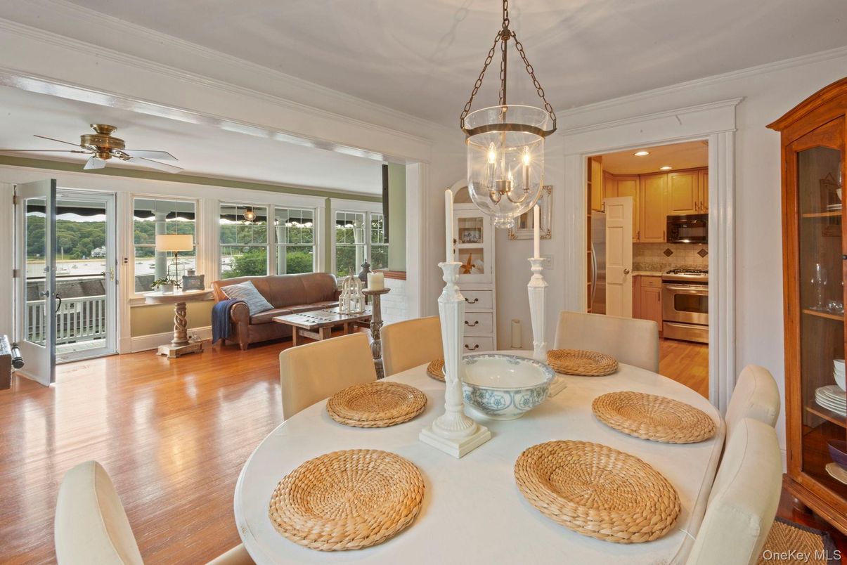 Chandelier, Dining room, Interior, Kitchen, Living room, Pendant Lights, Recessed Lighting, Stainless Steel Appliances, Wood Texture Flooring