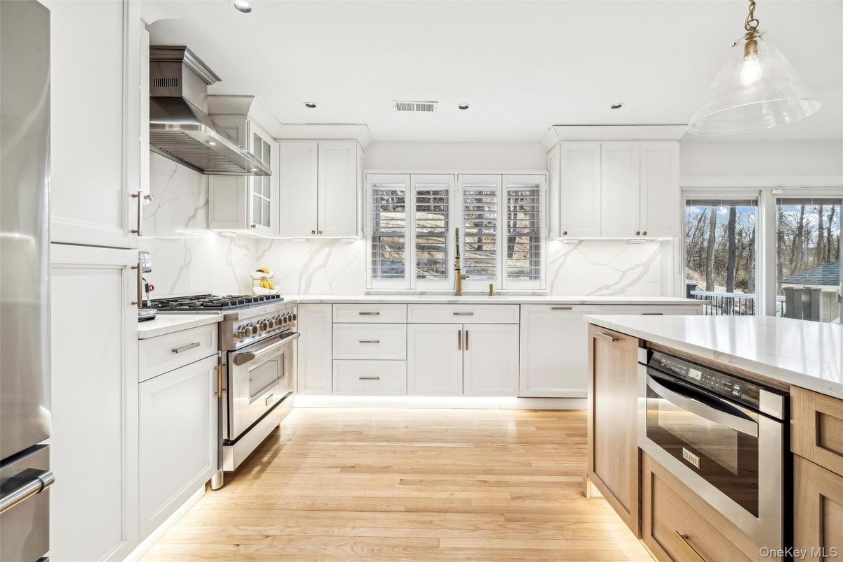 Interior, Kitchen, Marble Walls, Pendant Lights, Recessed Lighting, Stainless Steel Appliances, Wood Texture Flooring