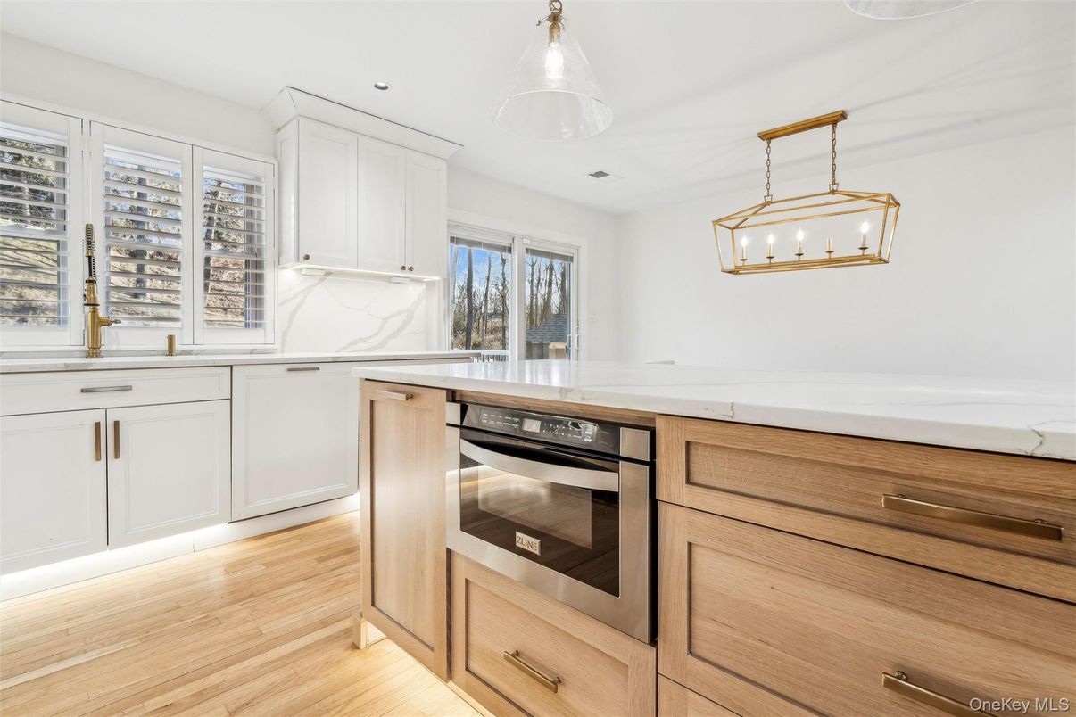 Interior, Kitchen, Marble Walls, Pendant Lights, Recessed Lighting, Stainless Steel Appliances, Wood Texture Flooring