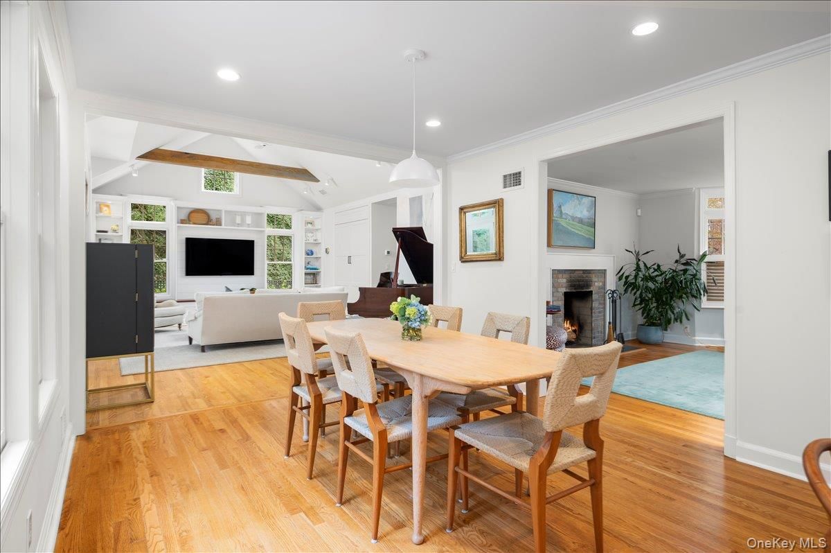 Dining room, Fireplace, Interior, Living room, Pendant Lights, Recessed Lighting, Wood Texture Flooring