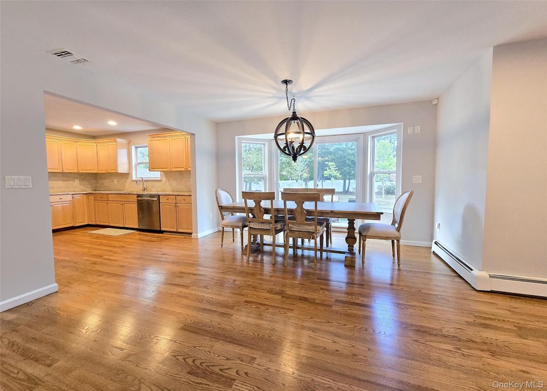 Chandelier, Dining room, Interior, Kitchen, Recessed Lighting, Stainless Steel Appliances, Wood Texture Flooring