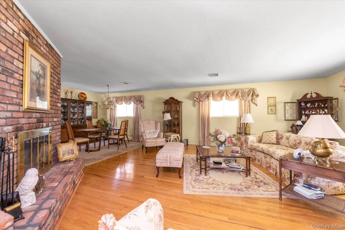 Chandelier, Dining room, Fireplace, Interior, Living room, Stone Walls, Wood Texture Flooring