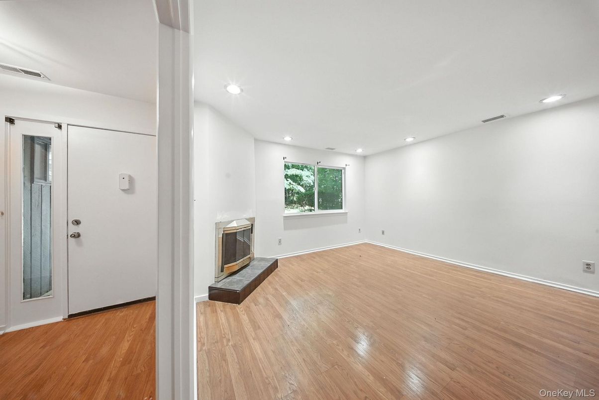 Empty room, Fireplace, Interior, Recessed Lighting, Wood Texture Flooring