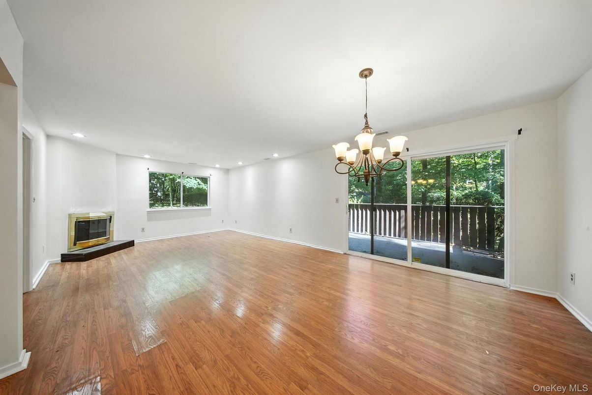 Chandelier, Empty room, Fireplace, Interior, Recessed Lighting, Wood Texture Flooring