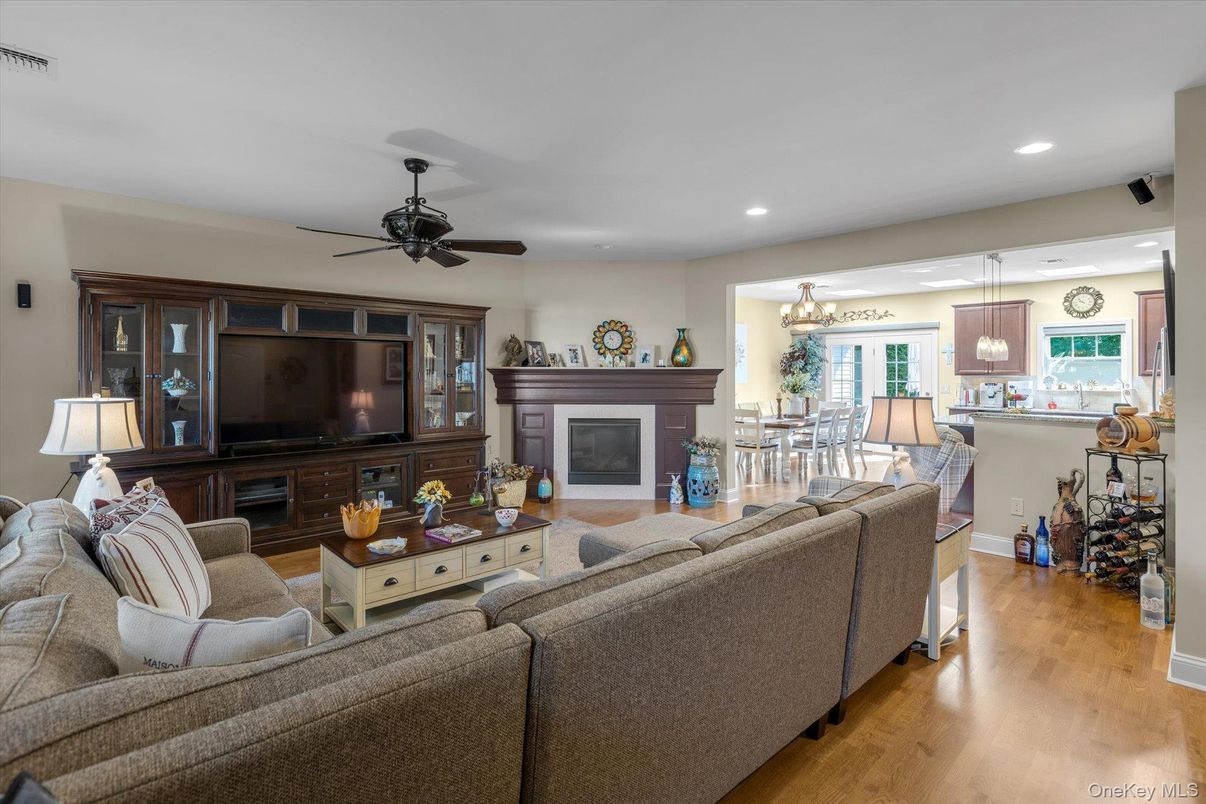 Chandelier, Dining room, Fireplace, Interior, Living room, Pendant Lights, Recessed Lighting, Wood Texture Flooring