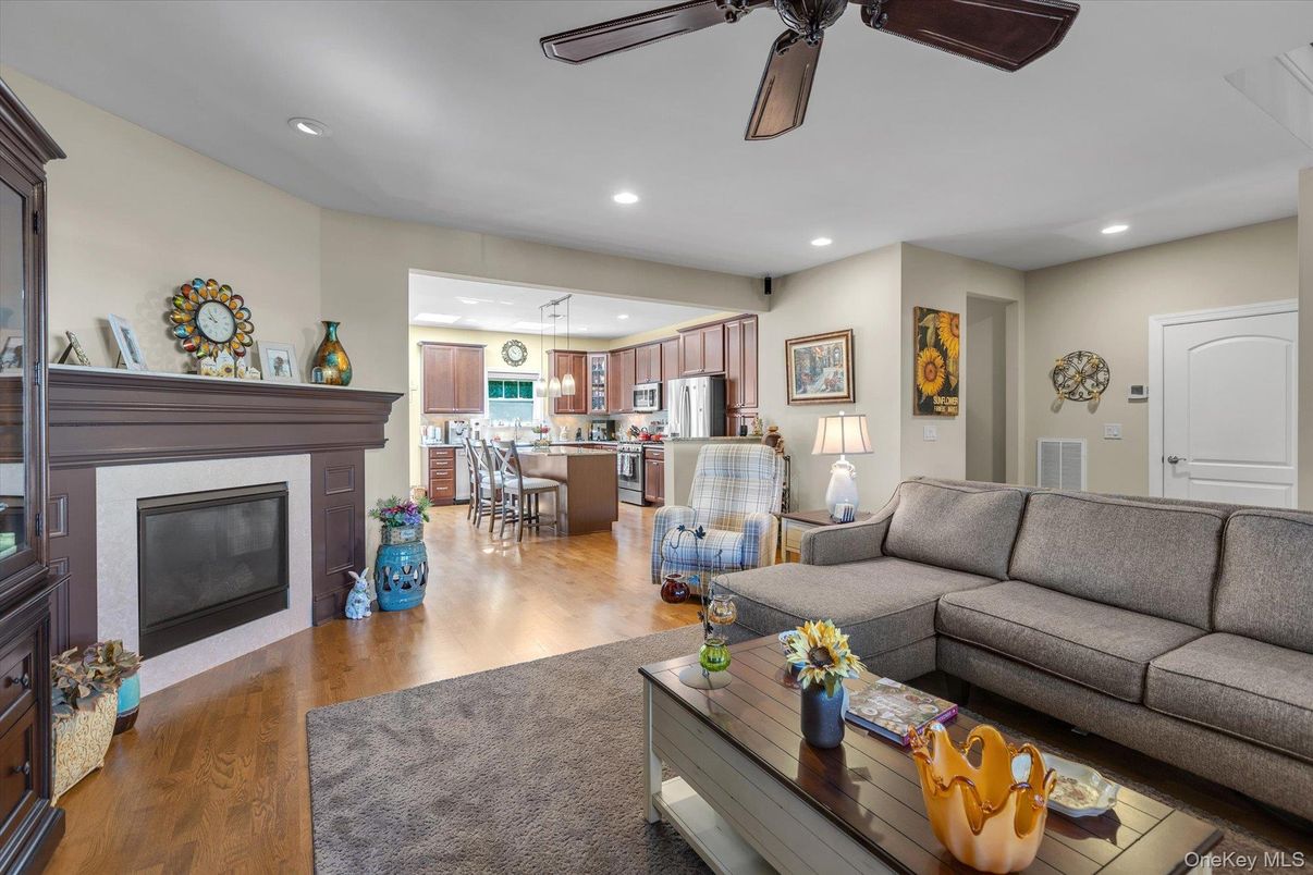 Dining room, Fireplace, Interior, Kitchen, Living room, Pendant Lights, Recessed Lighting, Stainless Steel Appliances, Wood Texture Flooring